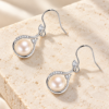 Pearl Teardrop Hook Earrings — styled display