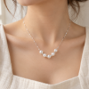 Pearl Rhythm Necklace — wearing illustration