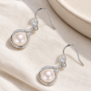 Pearl Teardrop Hook Earrings — editorial setting