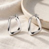 Soft Triangle Hoop Earrings — editorial setting