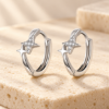 Starlight Huggie Hoops — styled display