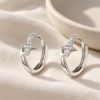 Starlight Huggie Hoops — editorial setting