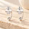 Clover Curve Earrings — styled display