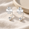 Clover Curve Earrings — editorial setting