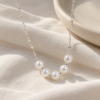 Pearl Rhythm Necklace — editorial setting